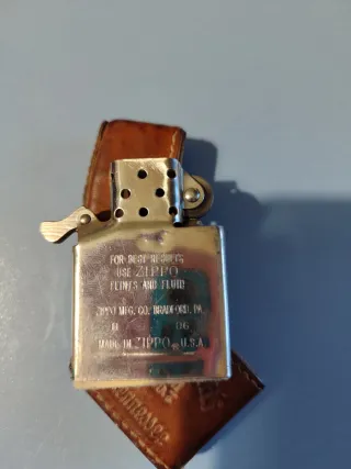 Lott di collezionismo: Petaca, Zippo, armonica