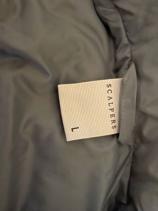 Chaleco Scalpers plumífero gris. Azulón