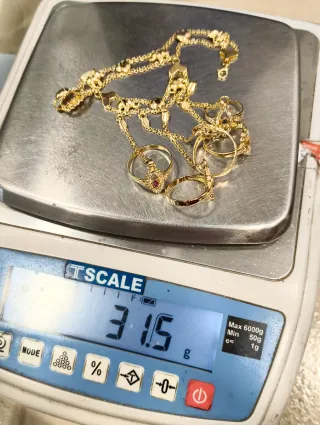 Manita de oro 18kt con 5 anillos lanzadera