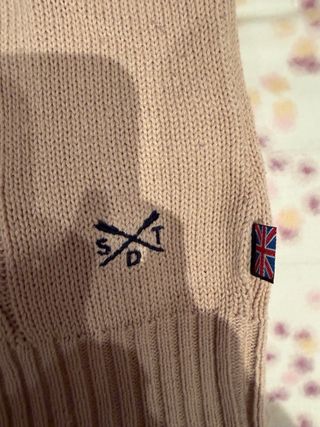 Jersey de punto trenzado color crema