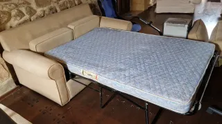 Sofá cama beige tela y metal