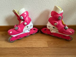 Patines rosas con protecciones y casco