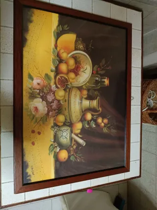 Quadro con cornice dorata e foto