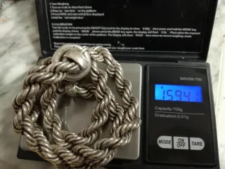 Cordón de plata trenzado..160 gramos.57 cm.