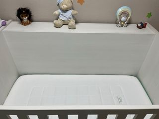 Cuna convertible con cambiador