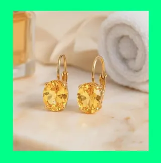 Pendientes ovalados dorados con piedra amarilla