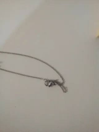 Collar abrazo figuras plata y oro