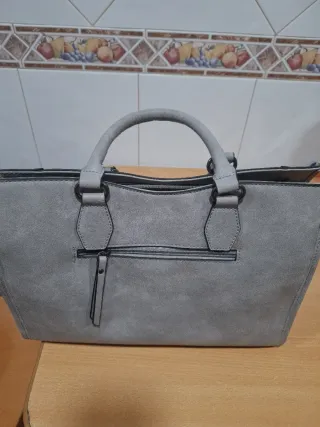 Bolso gris nuevo a estrenar