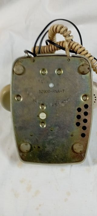 Teléfono antiguo Heraldo de rueda beige