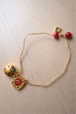 Pulsera de la suerte china dorada y roja