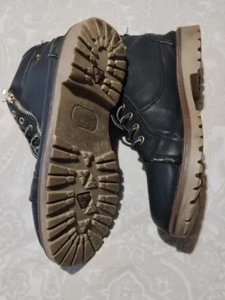 Botines piel negros con varias hebillas decorativa