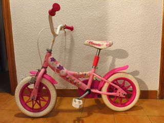 Bicicleta infantil rosa con flores
