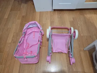 Carro de muñecas rosa.