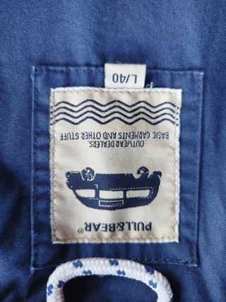 Parka azul con capucha de entretiempo