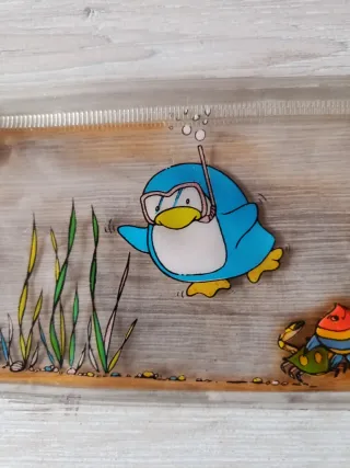 Estuche antiguo con dibujos de pingüinos