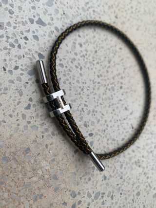 Pulsera Hermes Negra y Dorada