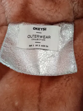 Abrigo plateado con forro rosa