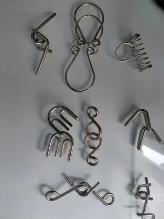 Lote de 8 rompecabezas metálicos