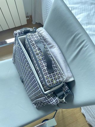 Trona de viaje portatil.