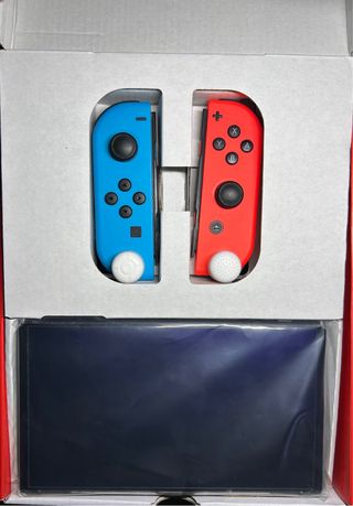 Nintendo Switch OLED Rossa e Blu - Completa