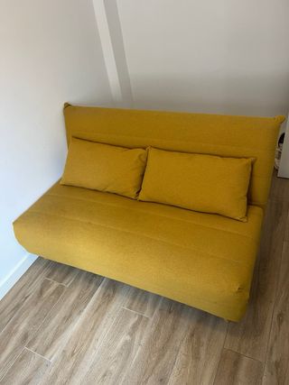 Sofá cama amarillo de tela