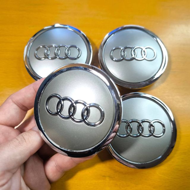 TAPABUJES AUDI 69mm GRIS · EMBLEMA LLANTAS AUDI