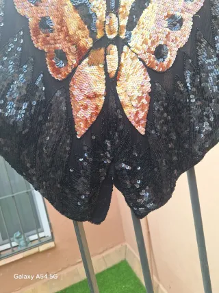 Top lentejuelas mariposa negro y naranja