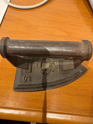 Plancha antigua de hierro fundido