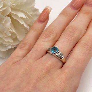 Anillo oro blanco 14kt con gema azul