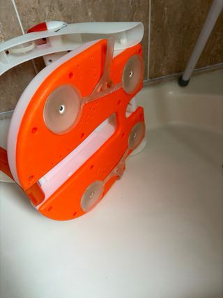 Asiento bebé bañera naranja y blanco jané
