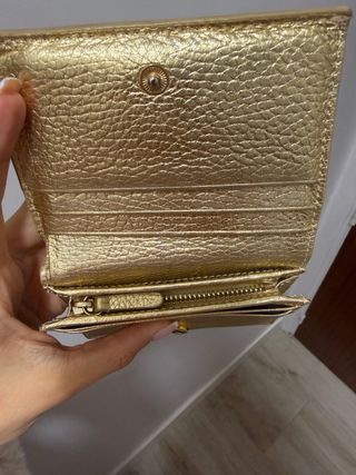 Cartera Coccinelle dorada cuero