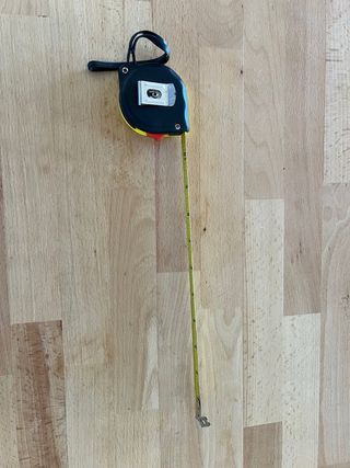 Flexómetro amarillo con cordón