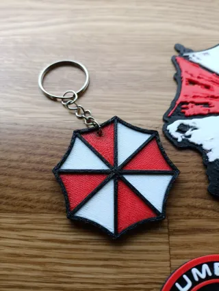 Llavero, posavasos y moneda Resident Evil