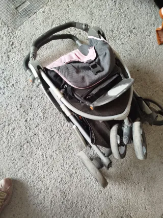 Carro de bebé rosa y gris