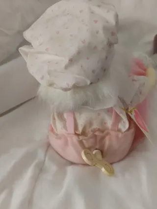 Muñeca musical con vestido rosa