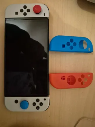 Nintendo Switch OLED + 2 Giochi e Accessori