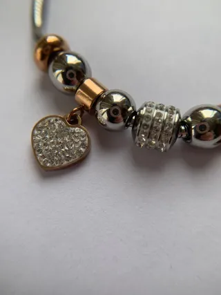 Pulsera charms bañada en oro rosa