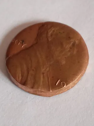MONEDA 1 CENTAVO LINCOLN.19??.ERROR MAL RECORTADA.