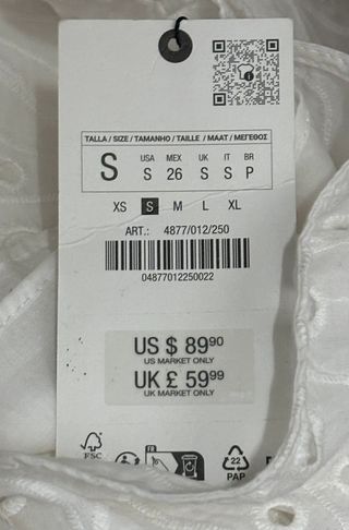 Vestido blanco bordado midi asimétrico Zara