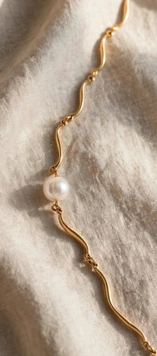 Cadena Majorica bañada en oro con perla
