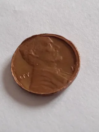 MONEDA 1 CENTAVO LINCOLN.19??.ERROR MAL RECORTADA.