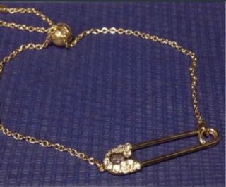 PULSERA SWAROVSKI DORADA. NUEVA