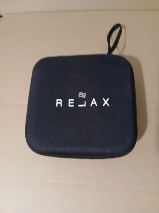 pistola de masaje Rejax con estuche de transporte.