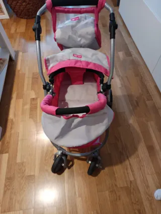 Cochecito de juguete rosa y gris