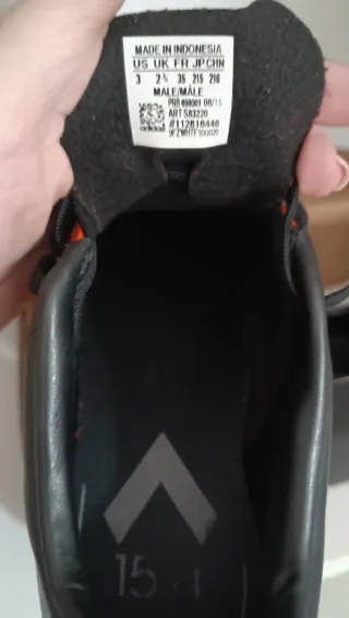 Botas multitaco fútbol niño naranja