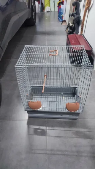 Jaula para pájaros azul y naranja