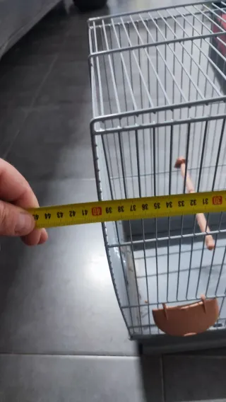 Jaula para pájaros azul y naranja