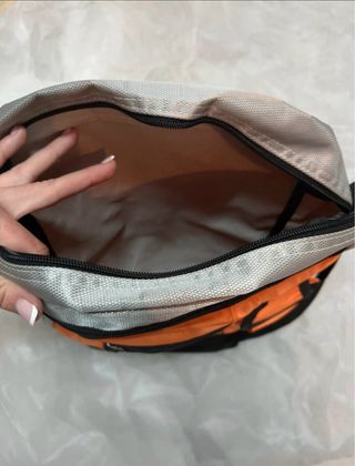 bandolera multibolsillos espaciosa