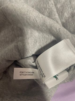 Chaqueta Lacoste Amarilla reversible. Impermeable