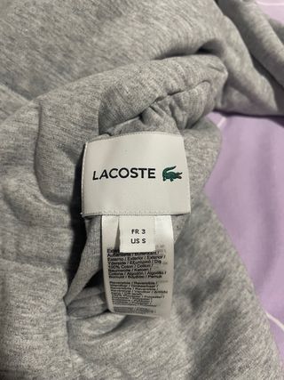 Chaqueta Lacoste Amarilla reversible. Impermeable